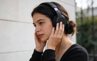 Consumer wearing headphones
