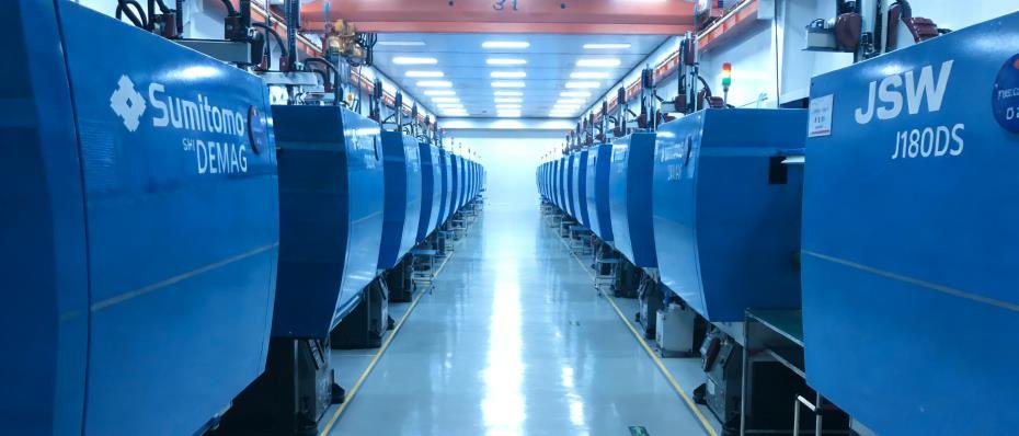 Row of TK injection molding machines on the production floor